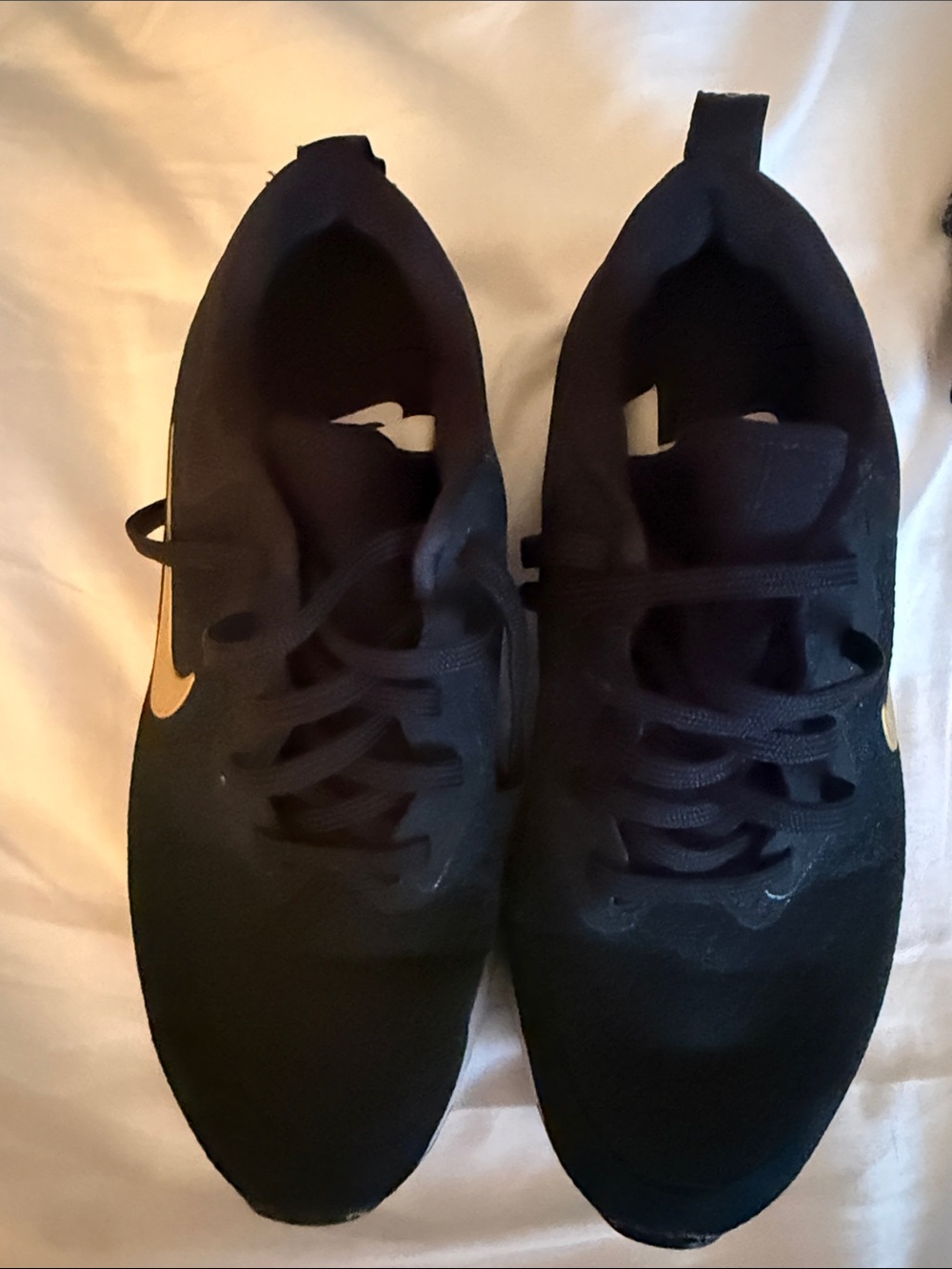 Nike Women's Black Sneakers with Gold Swoosh Accent